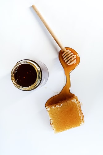 honey jar, honeycomb and wand